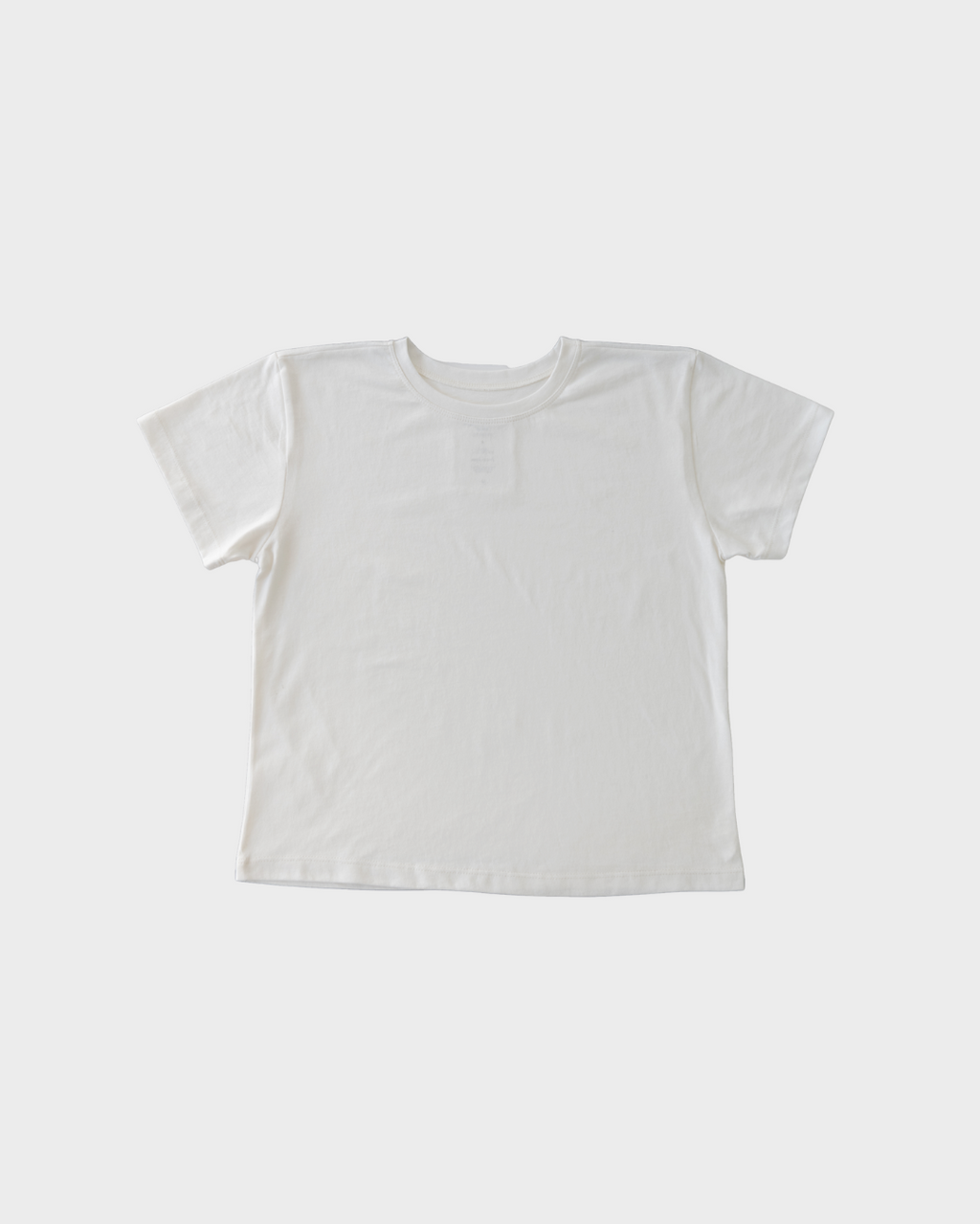 White t-shirt on a light gray background